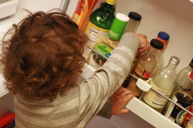 toddler making fries - 8 picking out ketchup