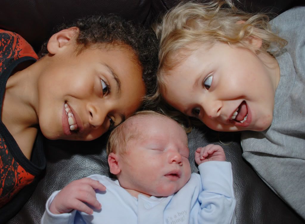 siblings with new baby brother