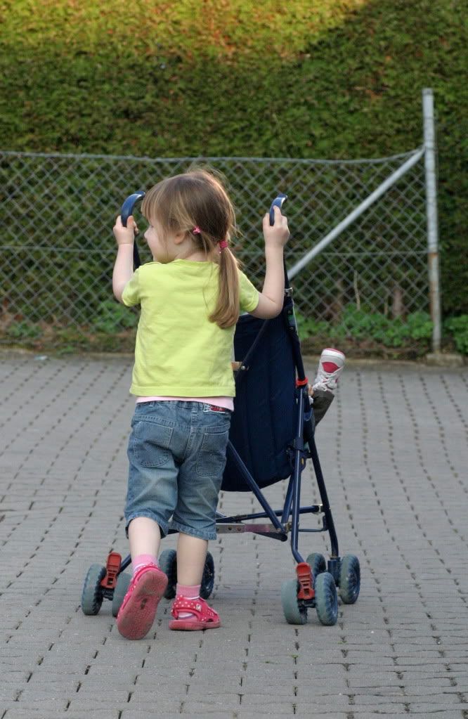 girl pushing stroller