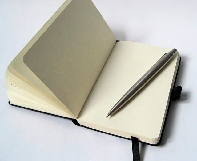 moleskin notebook journal and pen