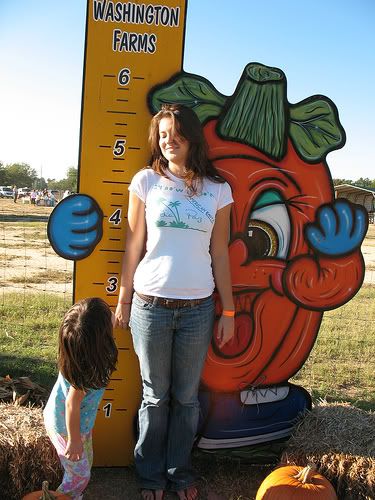 child and teen measuring their height