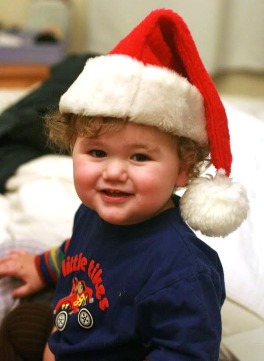 Toddler in Santa hat at Christmas