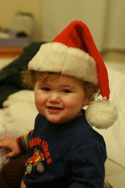 Toddler in Santa hat at Christmas