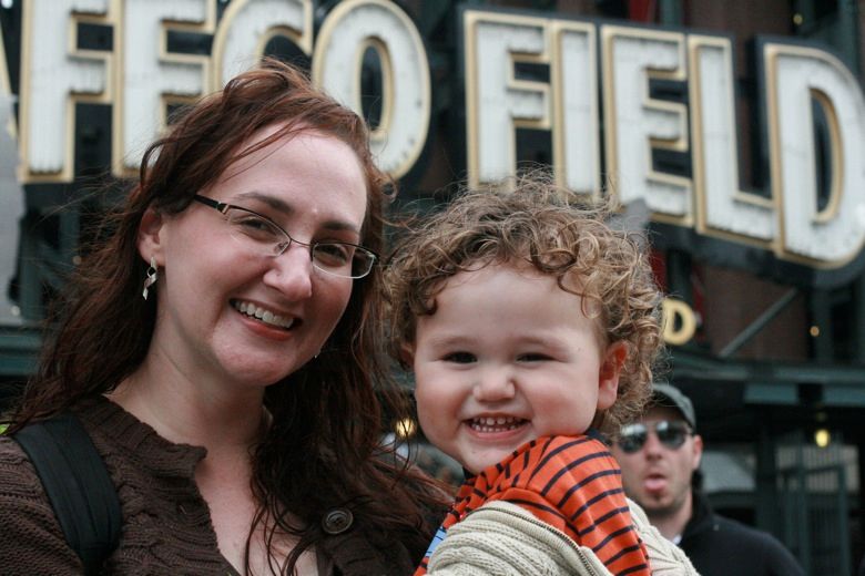 Mama and toddler at Safeco Field for baseball game