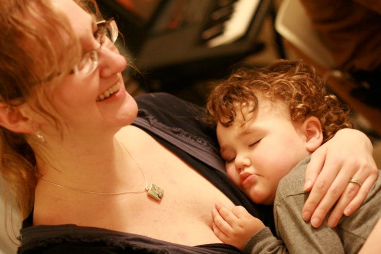 toddler asleep on mama's chest