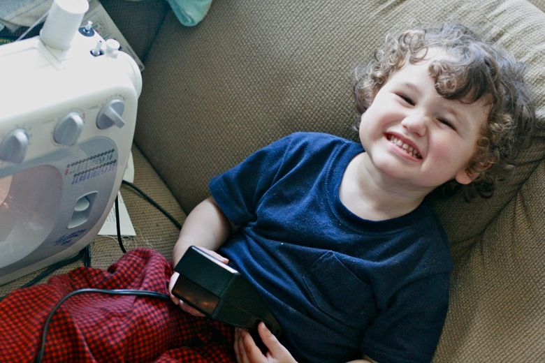 January Carnival of Natural Parenting 2012: Pros and cons of family cloth = Hobo Mama boy helping sew family cloth handkerchiefs