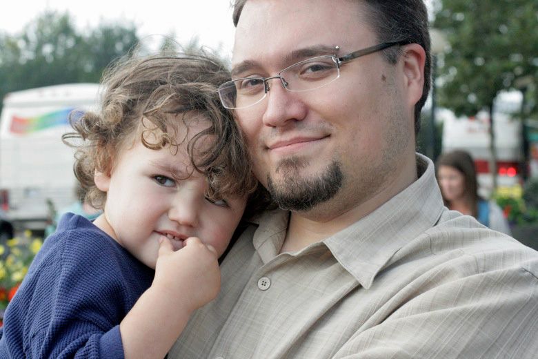 son and father cuddling