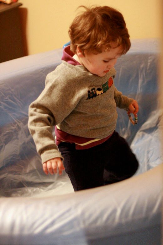 homebirth — boy helping inflate birthing tub