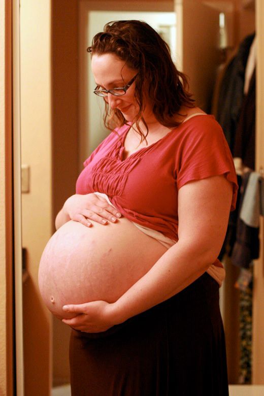 homebirth — pregnant bare belly pic during labor