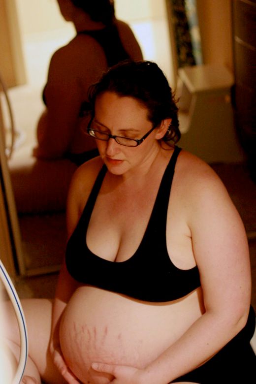 Alrik's birth story: Sweet surprise unassisted home water birth = Hobo Mama homebirth — laboring in home birth near mirror
