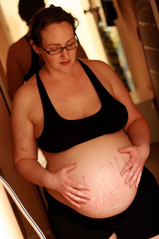 Alrik's birth story: Sweet surprise unassisted home water birth = Hobo Mama homebirth — laboring in home birth near mirror
