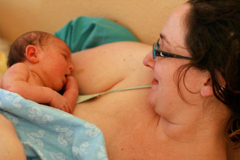 Alrik's birth story: Sweet surprise unassisted home water birth = Hobo Mama homebirth — newborn baby and mama