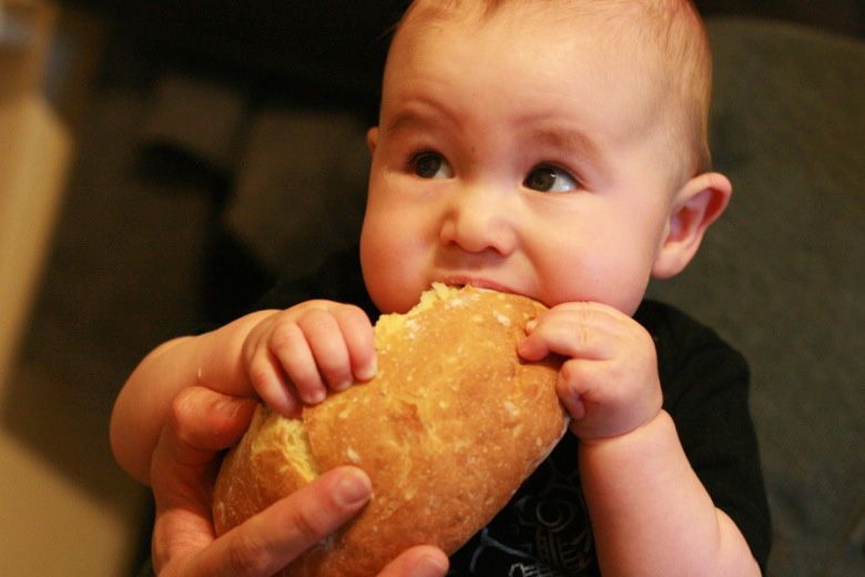 Celebrating Advent week to week: Hobo Mama baby eating Communion Jesus bread — home church
