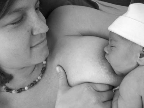Moment of Tenderness: mother breastfeeding a newborn baby