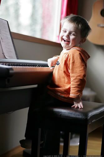 toddler playing piano