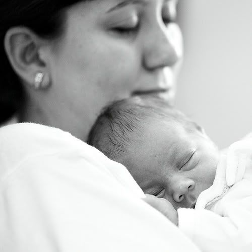 sleeping baby peaceful in mother's arms