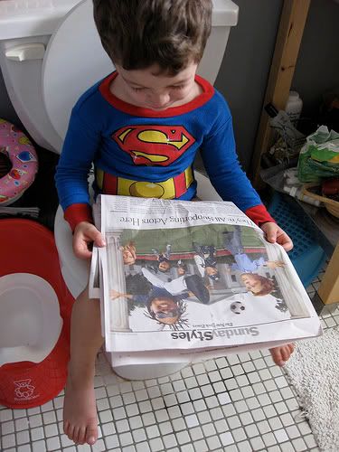 potty training Superman reading the newspaper