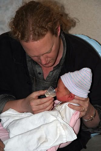 cup feeding newborn baby