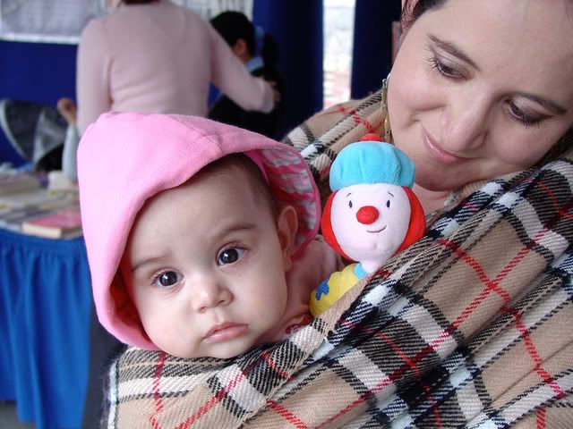 baby girl in sling with mama
