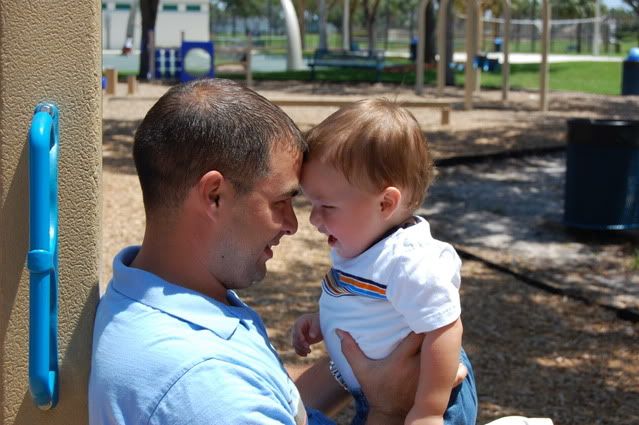 baby boy playing with daddy