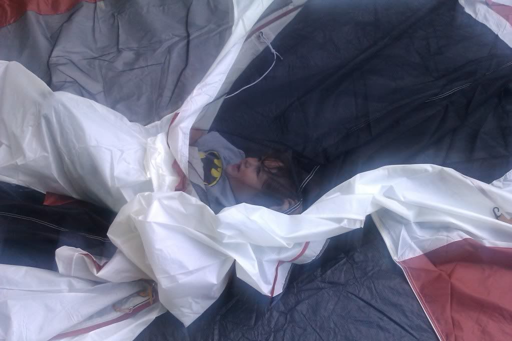 Photo Credit: Hobo Mama boy in collapsed tent during setup at campsite