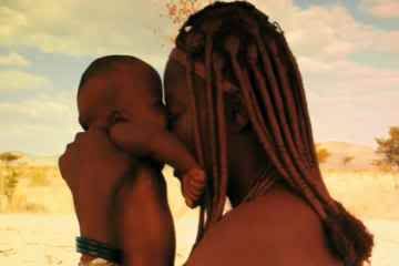 Babies by Thomas Balmes -- Ponijao Namibia kissing mother