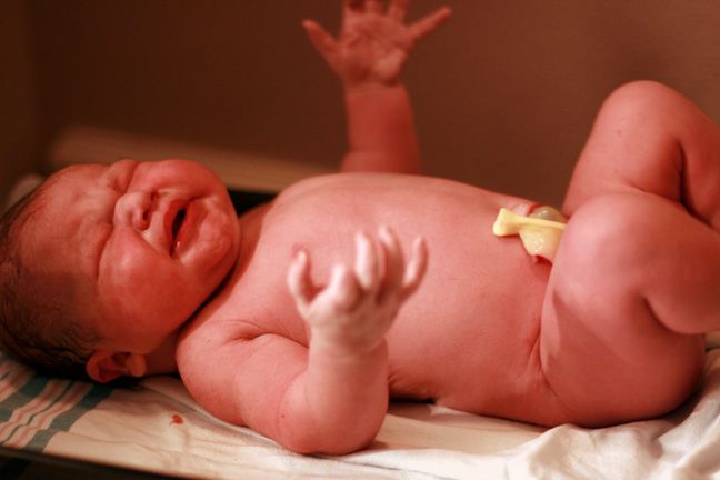 birth — newborn baby on the scales