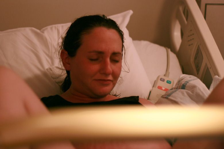 birth — pushing during labor in hospital bed