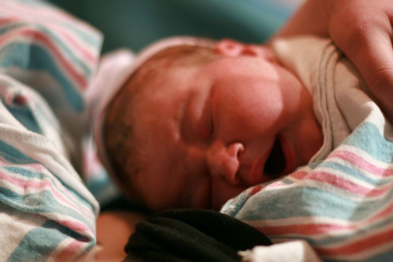 birth — big newborn baby yawn