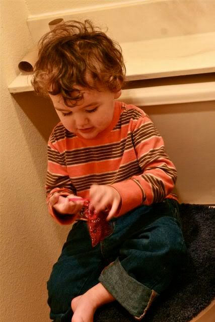 toddler playing with Diva Cup bag