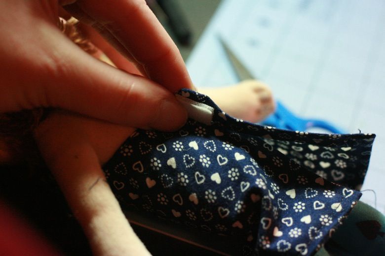 Photo Credit: Hobo Mama putting velcro on back of dress — doll clothes craft tutorial