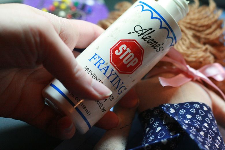 Photo Credit: Hobo Mama fray checking ribbon for halter — doll clothes craft tutorial