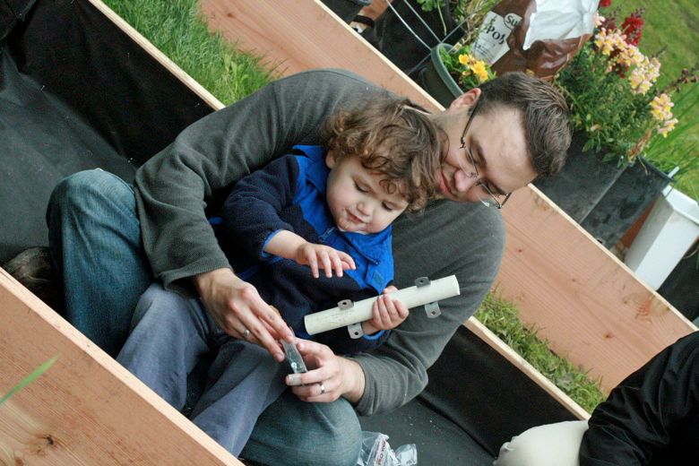 fastening pvc pipe to the side of the raised garden bed