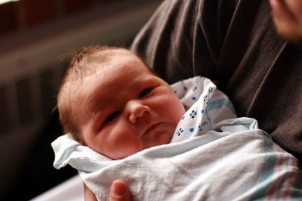 Baby burrito the day of birth with daddy