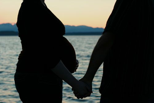 birth — 34 weeks pregnant belly pics silhouette with partner