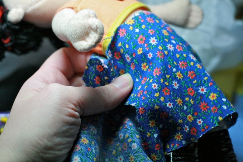 Photo Credit: Hobo Mama wrap skirt fabric around — doll clothes craft tutorial