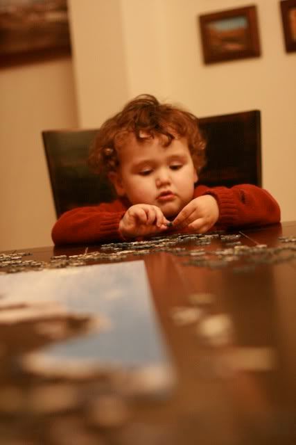 toddler doing jigsaw puzzle