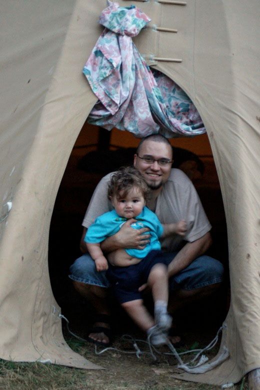 dad and boy in door of teepee while tipi camping on Vashon Island Mikko m1yo