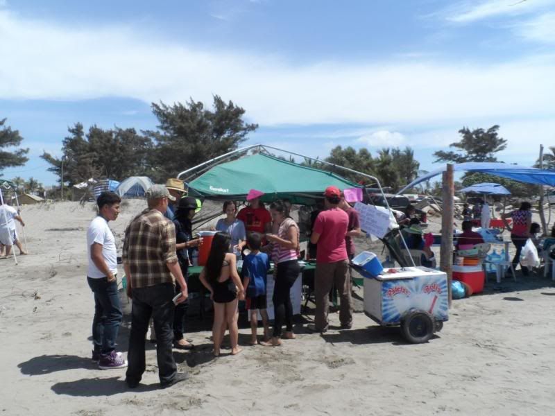 A cup of cold water -- beach outreach during Semana Santa.