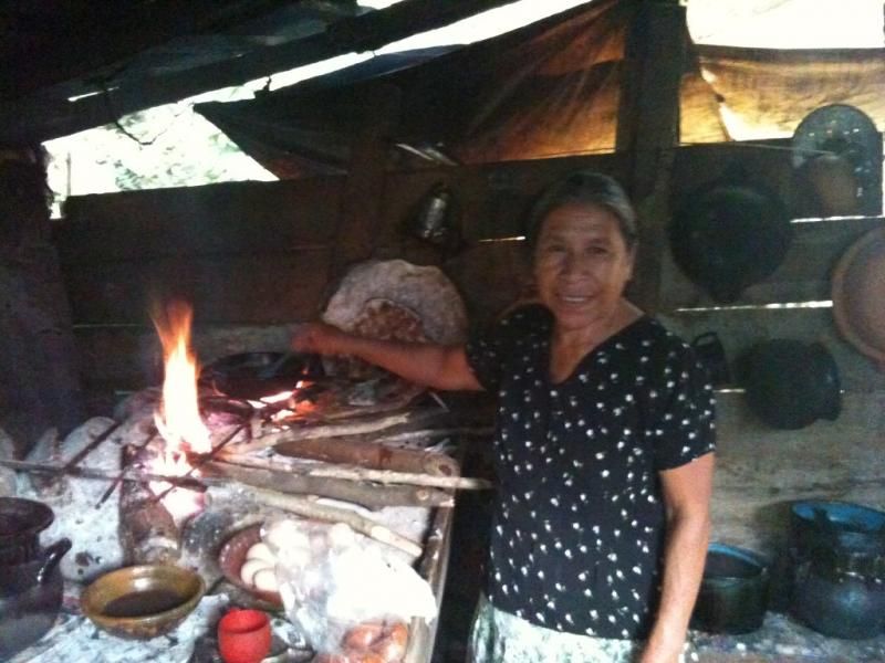 Woman cooking in the mountains.