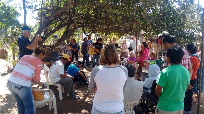 Church service under a tree at Cristino's house in Las Flores.