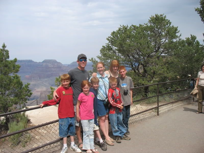 The family in front of an itty-bitty piece of the Grand Canyon.