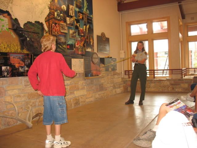 Jessee demonstrates the wingspan of a California Condor