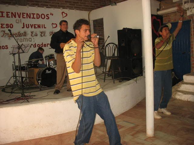 Aby and Esteban share a song at the monthly agape dinner