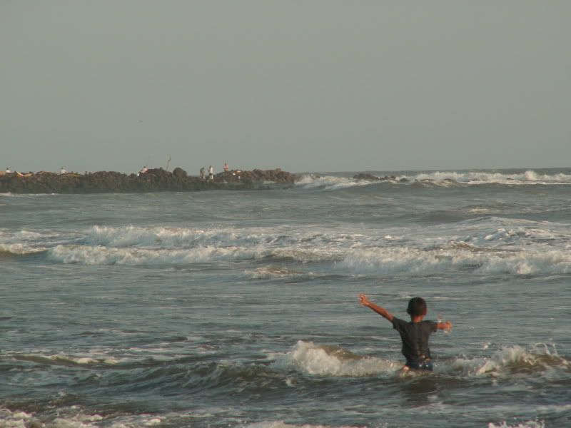 A little boy rejoices in God's ocean